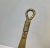 Elegant long shoe horn in brass decorated with draped detailing. It can be wall hung in your entrance. It was handmade in...