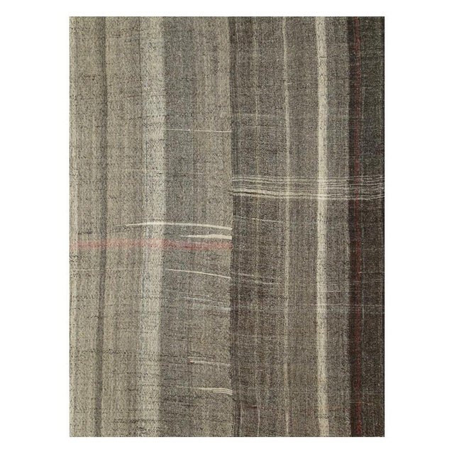A vintage tribal Turkish flat-weave Kilim room size carpet handmade during the mid-20th century with a Minimalist design...