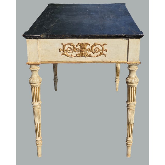 Elegant neoclassical console table, inspired by the Louis XVI style with Empire influences, characterized by sober lines...