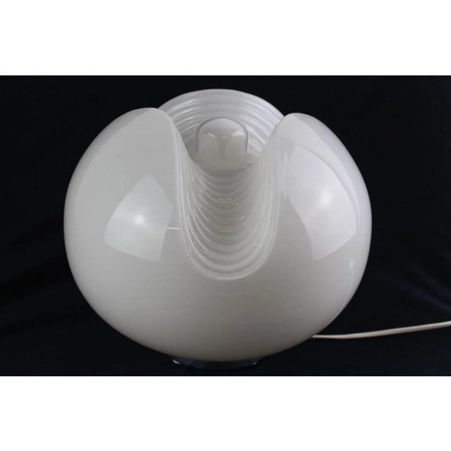 White opal glass, aluminium base, 1 socket E27, delivery without bulb. This piece has an attribution mark, I am sure that...