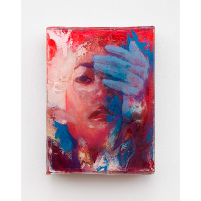 This artwork features a striking portrayal of a figure partially obscured by a hand, evoking a sense of introspection and...