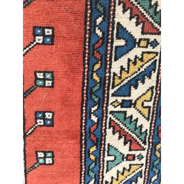 This is a knotted velvet and wool rug.