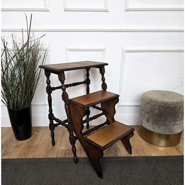 Beautiful Italian carved walnut wood step ladder with 3 stairs and nicely carved details and decorated structure. Each...