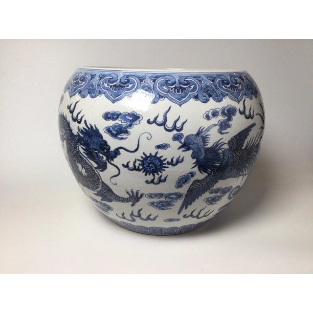 Classic Chinese blue and white porcelain jardinière with hand painted cobalt decoration. The white porcelain with painted...