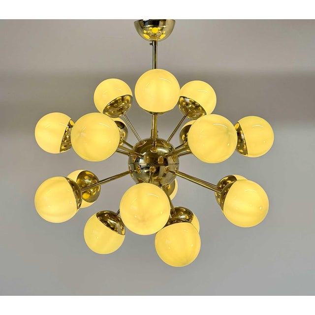 This Sputnik chandelier is crafted in Murano using authentic Murano glass, featuring sage green glass globes combined with...