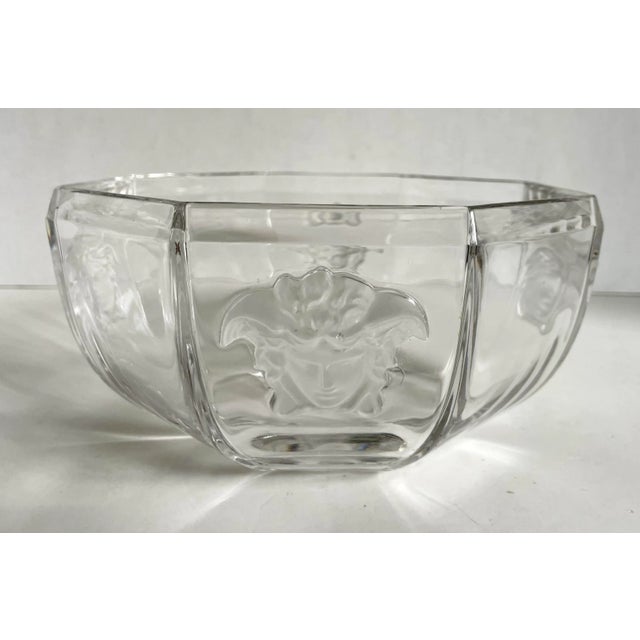 Here is an incredible crystal bowl designed by Versace, made by Rosenthal, featuring the Versace Medusa face on four...