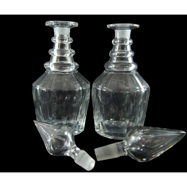 Decanter: 9 in tall Base: 3.5 x 5 x 2.5 inches Stopper: 4 inches Stoppers are similar but one is bigger in size.
