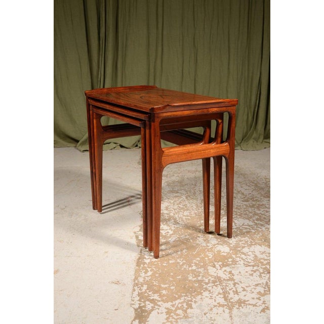 A stunning nest of three Danish mid century rosewood tables, by Domus Danica for Heltborg Møbler, of exceptional colour,...