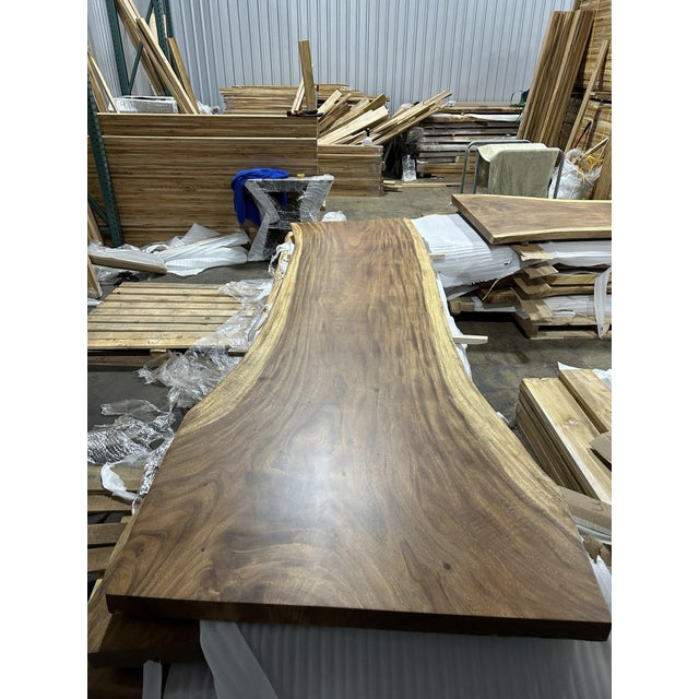 One tree. One top. One of one. A true single-slab live edge table: one continuous cross-section of a single Saman tree...