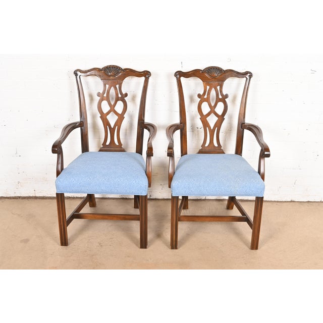 A gorgeous pair of Georgian or Chippendale style armchair or dining captain chairs By Drexel Heritage USA, Circa 1980s...