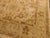 All over geometric motifs on tan background. Wool pile on cotton foundation.