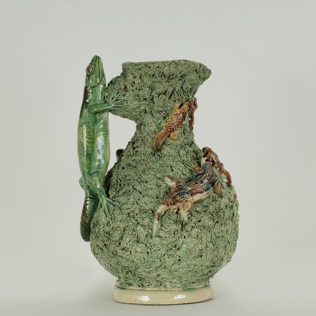 Whimsical 19th century Portuguese earthenware pitcher crafted in an eccentric composition with lizards and frogs on a...