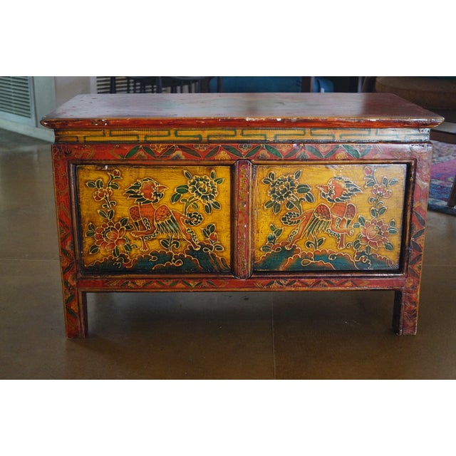 An old Tibetan altar / shrine table which is made of wood and hand painted. This beautiful piece opens with two doors at...
