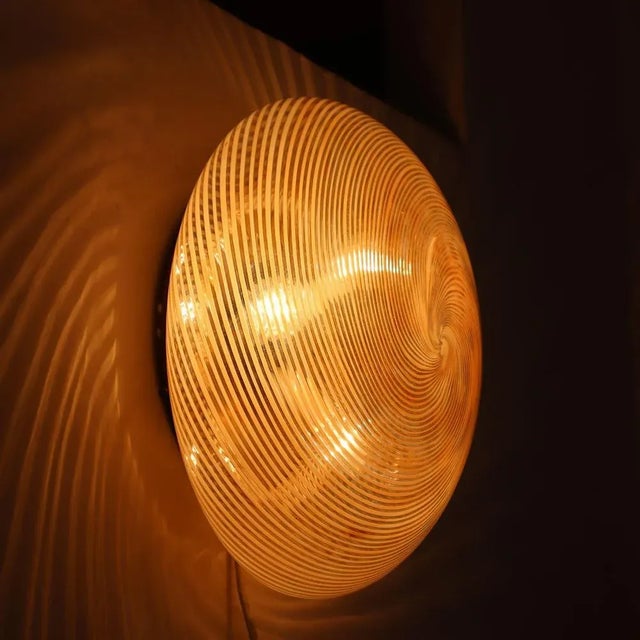 Venini wall lights from the 1950s represent the best of Italian design. Made of Murano glass, these works combine clean...