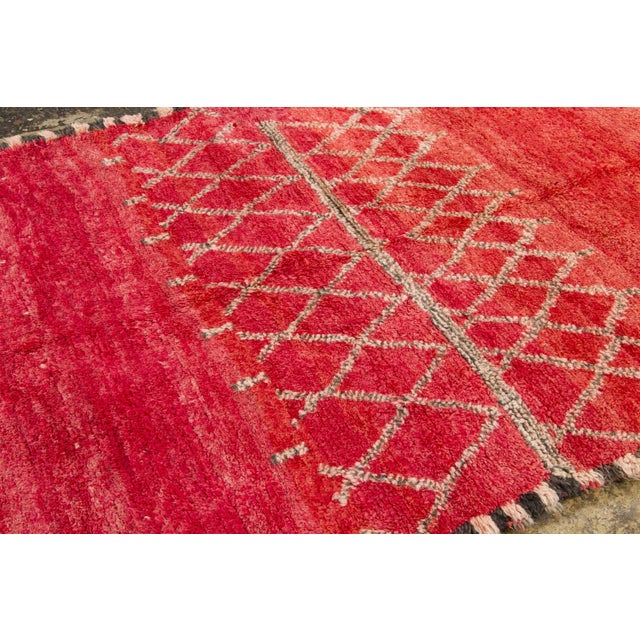 Hand-knotted in wool and originating circa 1950-1959, this 6x9 vintage Moroccan berber rug joins Rug & Kilim’s Moroccan...