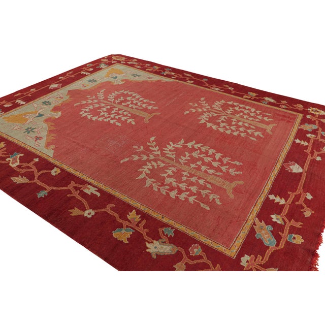 This rare 10x12 antique Oushak rug—hand-knotted in wool and originating from Turkey circa 1920-1930—is from our very...