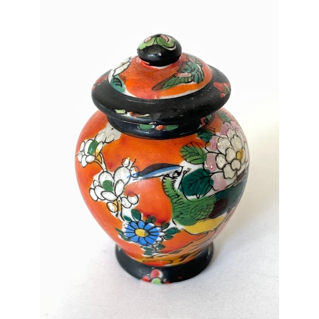 Hand painted Japanese porcelain miniature ginger jar with handled top. Old Japan motifs of a peacock with chrysanthemum...