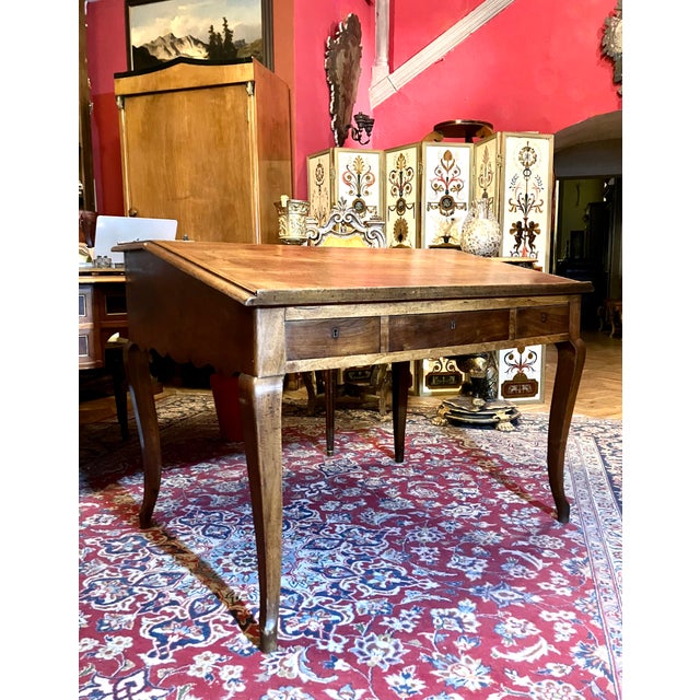 Elegant 1800s french writing desk in solid oak with cabriole legs and rich patina, a timeless antique that blends beauty,...