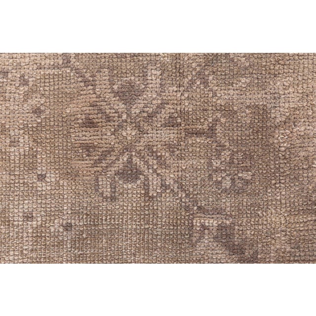 This remarkable oversized Turkish Oushak rug, dating from the 1880s, is a rare and exquisite example of Ottoman-era...