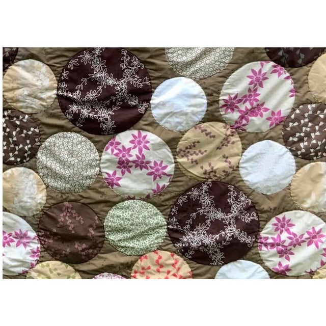 A truly one-of-a-kind handcrafted quilt with irresistible bohemian spirit — discovered at the legendary Marché aux Puces...