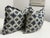 Design Plus Gallery presents a pair of Blue + Ivory Ikat Throw Pillows. Each pillow is upholstered in a woven textile...