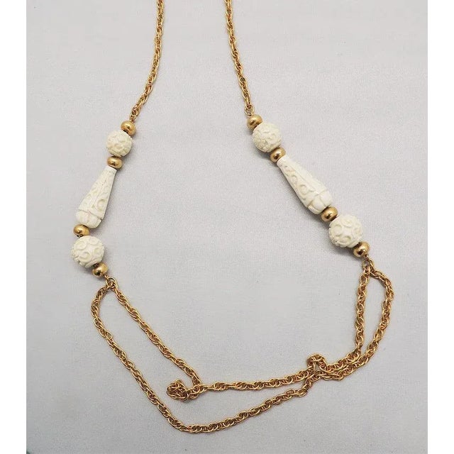 Modern Vintage 1970s Signed Crown Trifari Carved Faux-Ivory Sautoir Necklace For Sale - Image 3 of 9