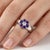 Delicate and timeless, this elegant floral-inspired ring features a captivating arrangement of Amethyst gemstones,...