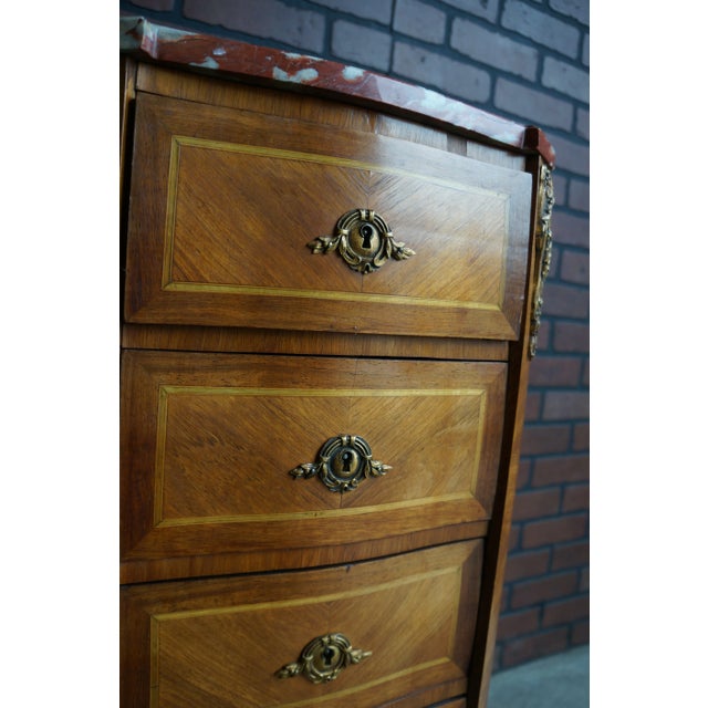 Magnificent Antique French nightstands with marble tops. These nightstands are incredible. The intricately patterned...