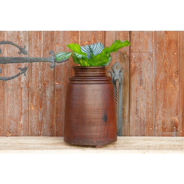 A stunning hand carved Nepalese wooden pot. These handmade containers were originally intended to store Ghee. It is...