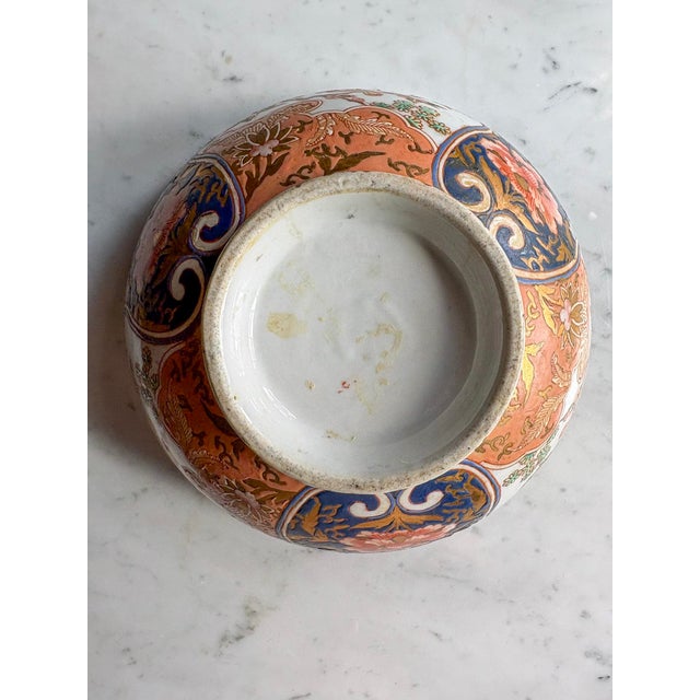 Ceramic Antique Japanese Imari Porcelain Bowl | Meiji Period | Lobed Form | Flower Basket & Phoenix Panels For Sale - Image 7 of 8