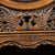 A vintage Chinese carved hardwood table screen, circular in form and mounted on an ornate openwork stand. The central...
