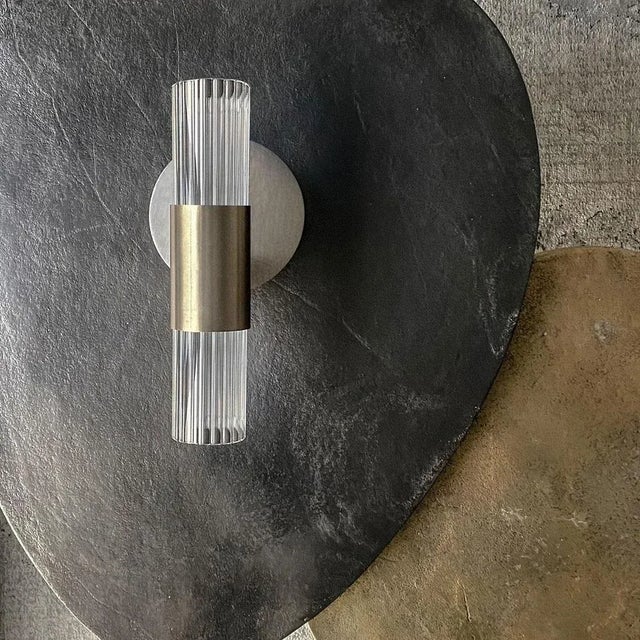 Sbarlusc wall lamp double by luce tu. Dimensions: ø 13 x w 45 h 27.5 cm. Materials: brass and glass. Cutting-edge...