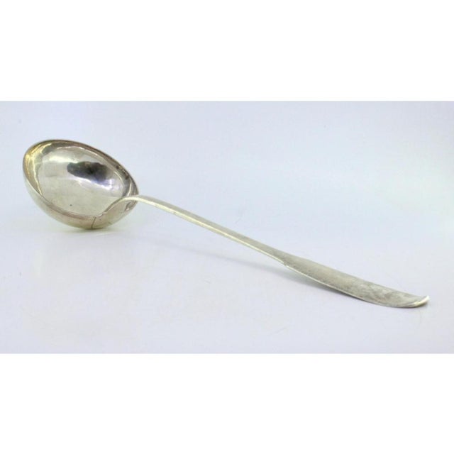 Silver Soup Ladle with Scalloped Handle, in Very Good conditions. Designed before 1890 This piece has an attribution mark,...