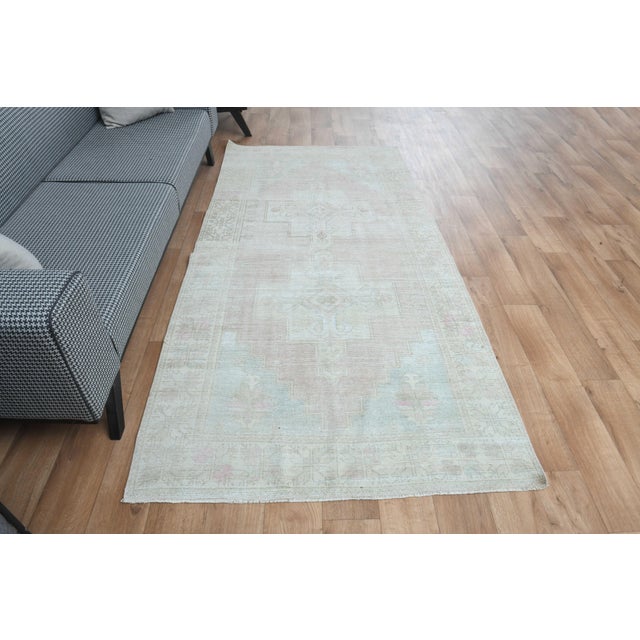 This vintage hand-knotted area rug is a semi-antique vintage area rug. The '70s Eastern region of Anatolian's unique rug...