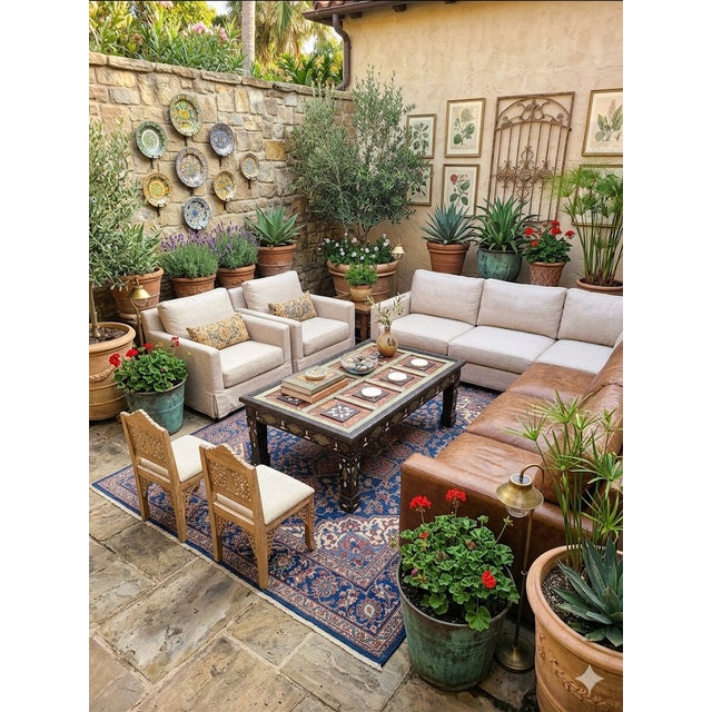 A new arrival. This beautiful cedar wood, resin fragments, stained leather patches and metal inlaid Moroccan coffee table...