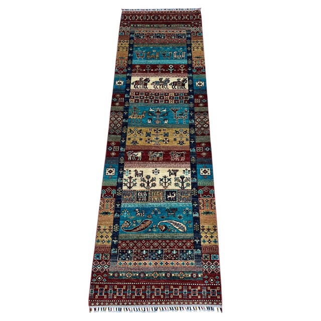 A khorjin-design runner, the pattern nomads once wove into saddlebags, here hand-knotted in northern Afghanistan from...