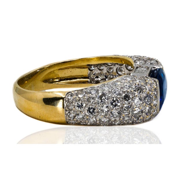 Platinum & 18k ring with approximately 2.80 carat vivid royal blue sapphire and approximately 1.75 carats of round and...
