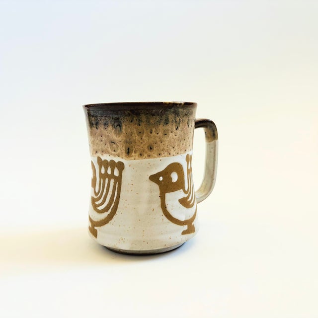 A mid century pottery mug. Lovely natural colored glazes with a scandinavian style bird design. Made in Japan, marked on...