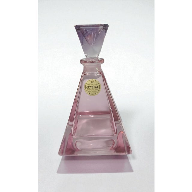 The product is a vintage Italian SC 24% lead crystal pink and purple art glass perfume bottle. This handmade bottle is a...