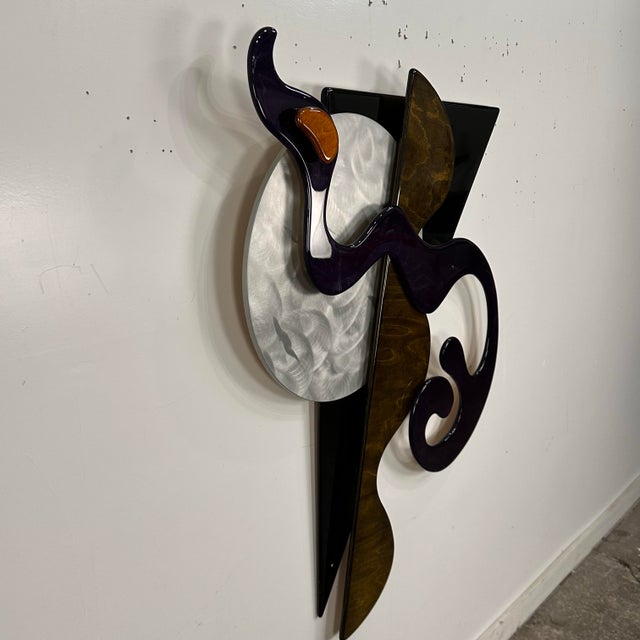 This is a modernist and contemporary abstract lacquered wooden wall sculpture. The piece features a dynamic, three-...