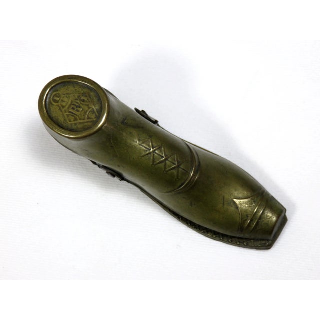 An Antique Brass Figurative Gentleman's Shoe Message Clip / Sometimes know as a Newspaper Clip. It can be used as hung on...