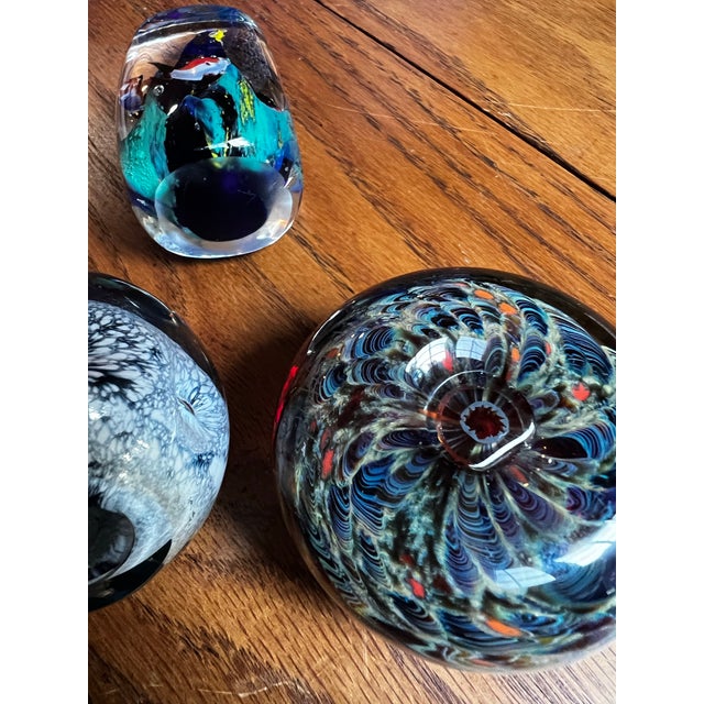 Up for consideration is a beautiful vintage collection of dark blue and green glass paperweights. These would look lovely...