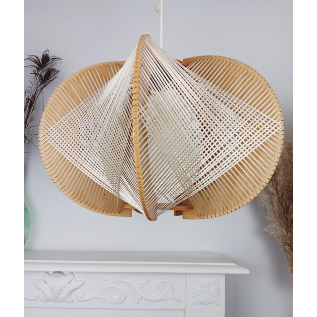 The perfect blend of retro charm and nature. Fall for the unique design of this vintage pendant light, a true marriage of...