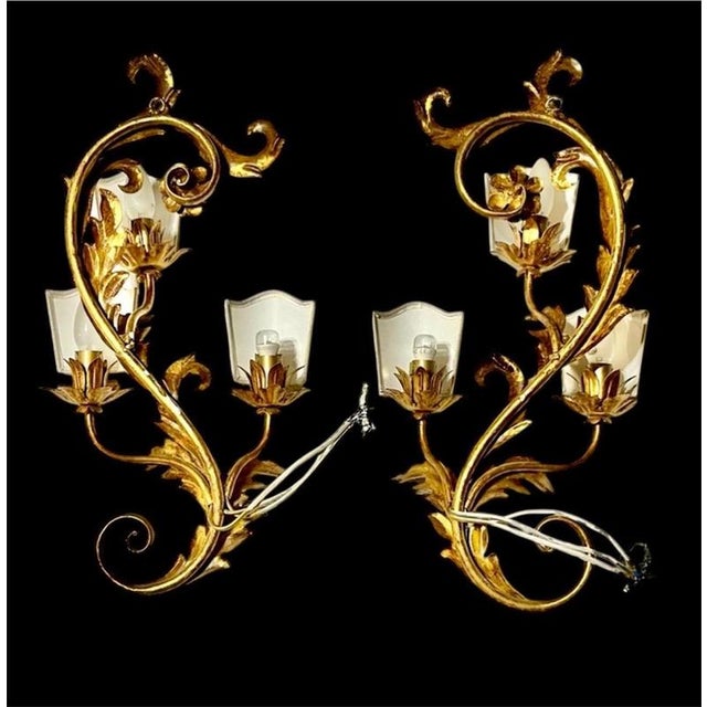 Oversized pair , wide florentine wall lamp from the 1970s with three sockets, in italy. Exceptional design with many...