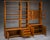 Elegant Danish modular wall unit by Dyrlund, crafted in teak during the 1970s. This versatile Mid-Century Modern storage...