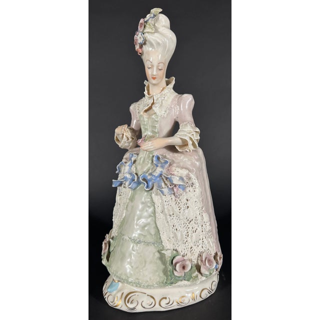 A Cordey China Co. porcelain figure featuring a flower encrusted French lady. Numbered 5061. Unsigned but certainly...
