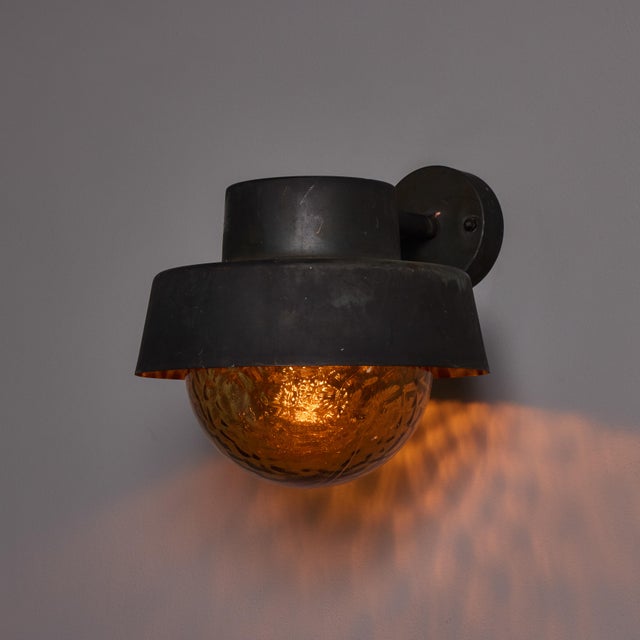 1970s Patinated Metal and Textured Amber Glass Outdoor Sconce Attributed to Hans Agne Jakobsson Executed in richly...