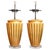 This is a striking pair of Art Deco-style gilt table lamps, featuring boldly fluted urn-form bodies with a warm hand-...