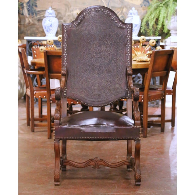 Bring stately French character to a study, dining room, or library with this pair of antique Louis XIII–style armchairs,...