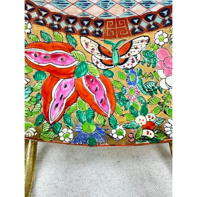 Vintage large Chinese export Famille Rose charger in the Rose Mandarin style with a brass stand. This is a pre owned item...